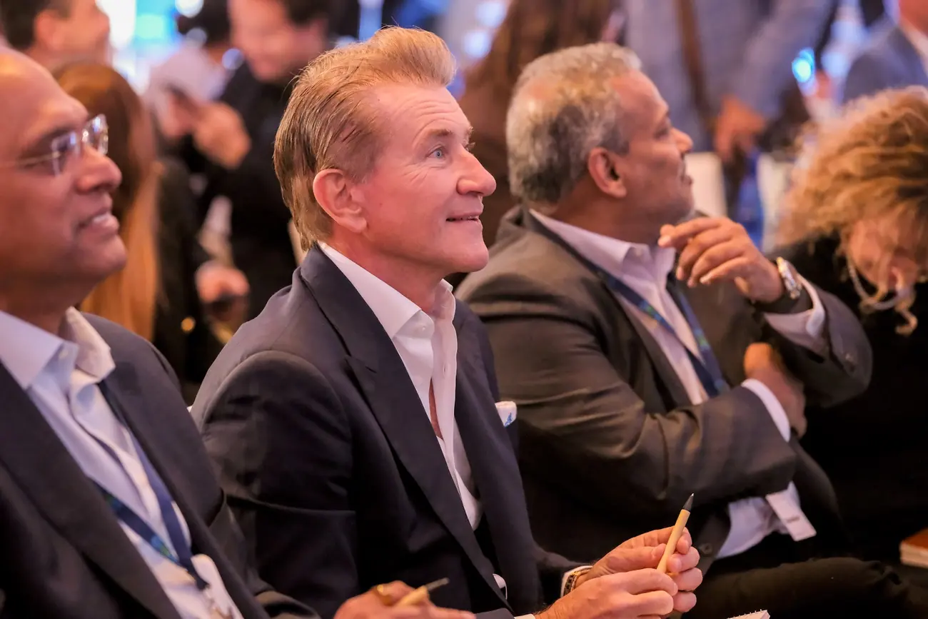 Robert Herjavec seated among the judges listening to a pitch
