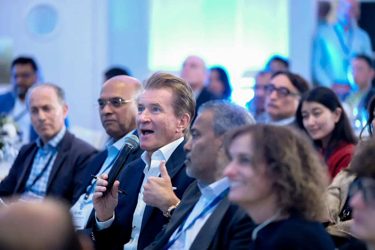 Robert Herjavec speaking into a microphone from the judges row